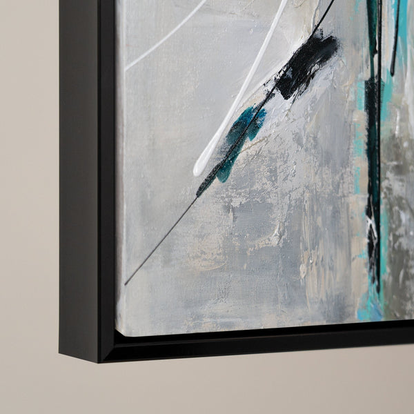 Close-up of a modern abstract painting in a dark frame, highlighting textured strokes and subtle color contrasts