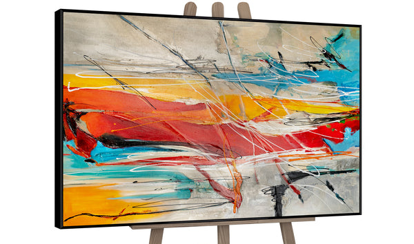 Dynamic abstract painting with bold strokes of red, blue, and yellow on canvas, framed and displayed on an easel