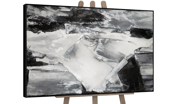 Artistic display of a monochrome abstract painting on an easel, featuring dynamic textures and shades of gray, ideal for modern art galleries and home decor enthusiasts.