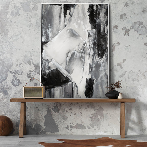 Stylish interior with large abstract black and white painting, vintage accessories, concrete wall, contemporary art