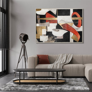 Abstract geometric painting with black, white, and red segments, accented with gold, in a sleek frame on a modern living room wall