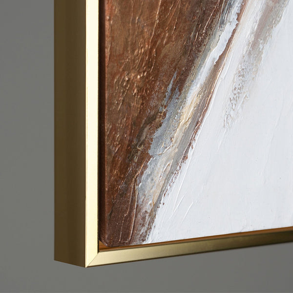 Close-up of a textured abstract painting featuring a gold frame, showcasing rich brown and white strokes with gold accents on a canvas