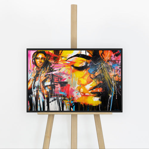 Handgemaltes Portraitbild „Symphonie der Farben" auf Staffelei – zwei expressive Gesichter in Gelb & Pink, schwarzer Rahmen