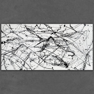 Hand-painted black and white drip art on rolled canvas